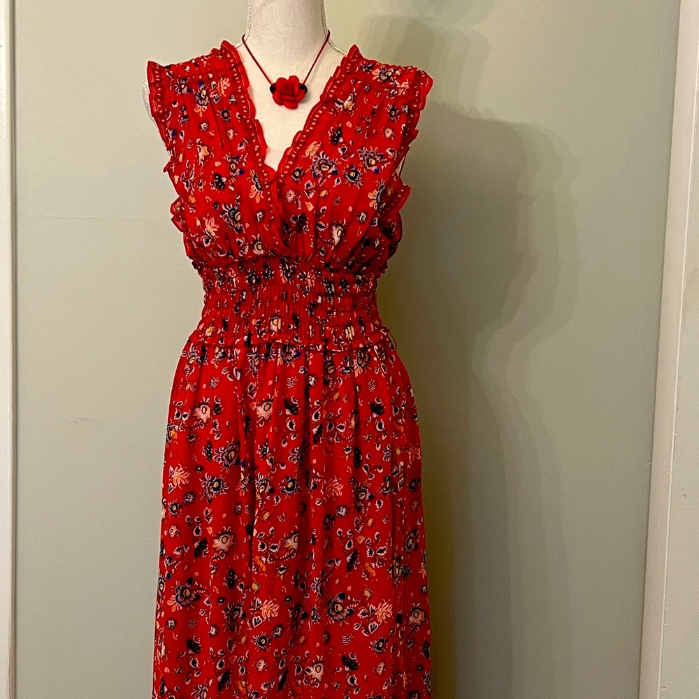 Beautiful red flowered v-neck chiffon lined sleeveless dress with smocked waist!